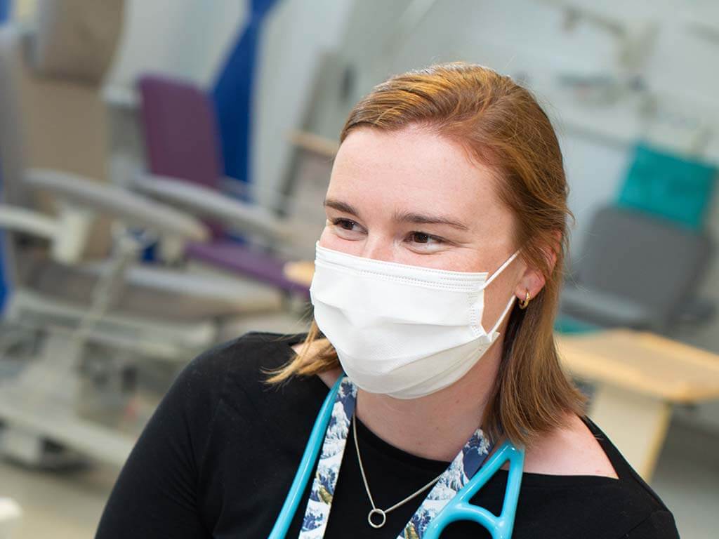 Smiling doctor wearing a mask